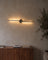 Slim LED wall light as a line of light above a sideboard