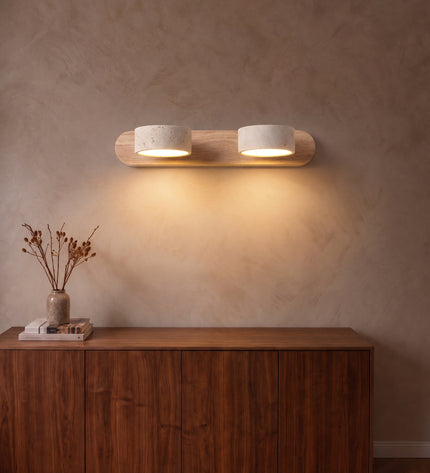 Cava wall light, 2 lights, travertine and natural wood, above a walnut sideboard