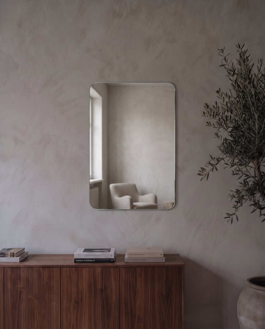 Alera self-adhesive wall mirror on a living room wall