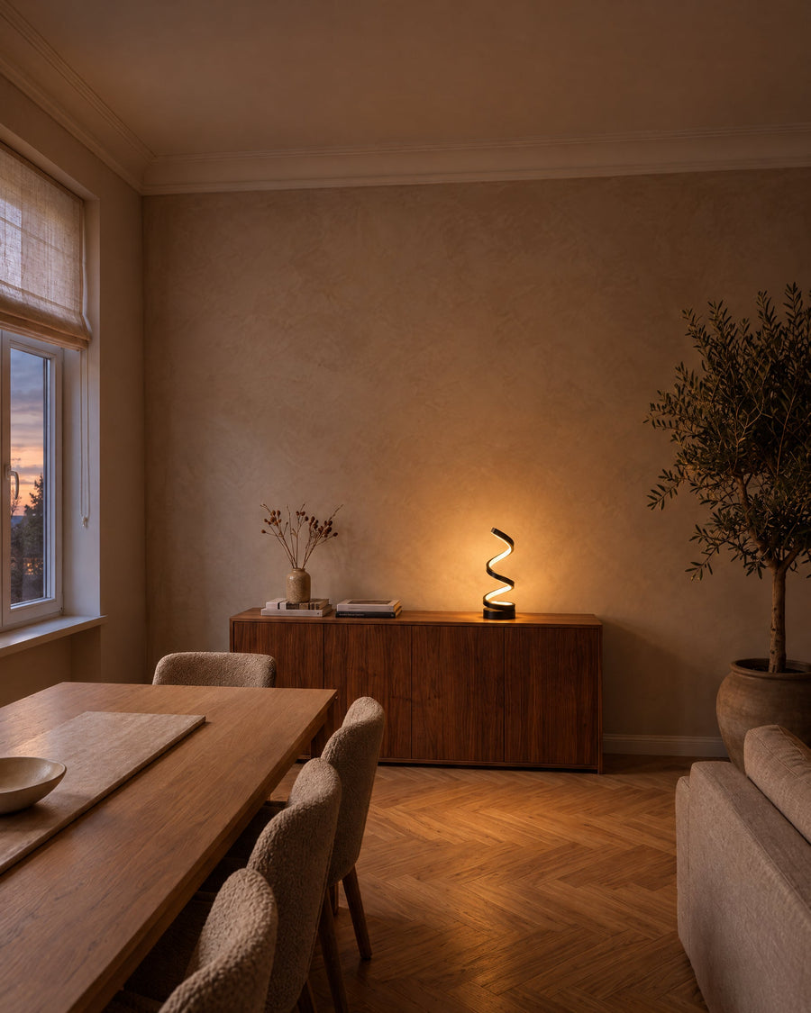 Spira table lamp on a sideboard in a dining room at dusk