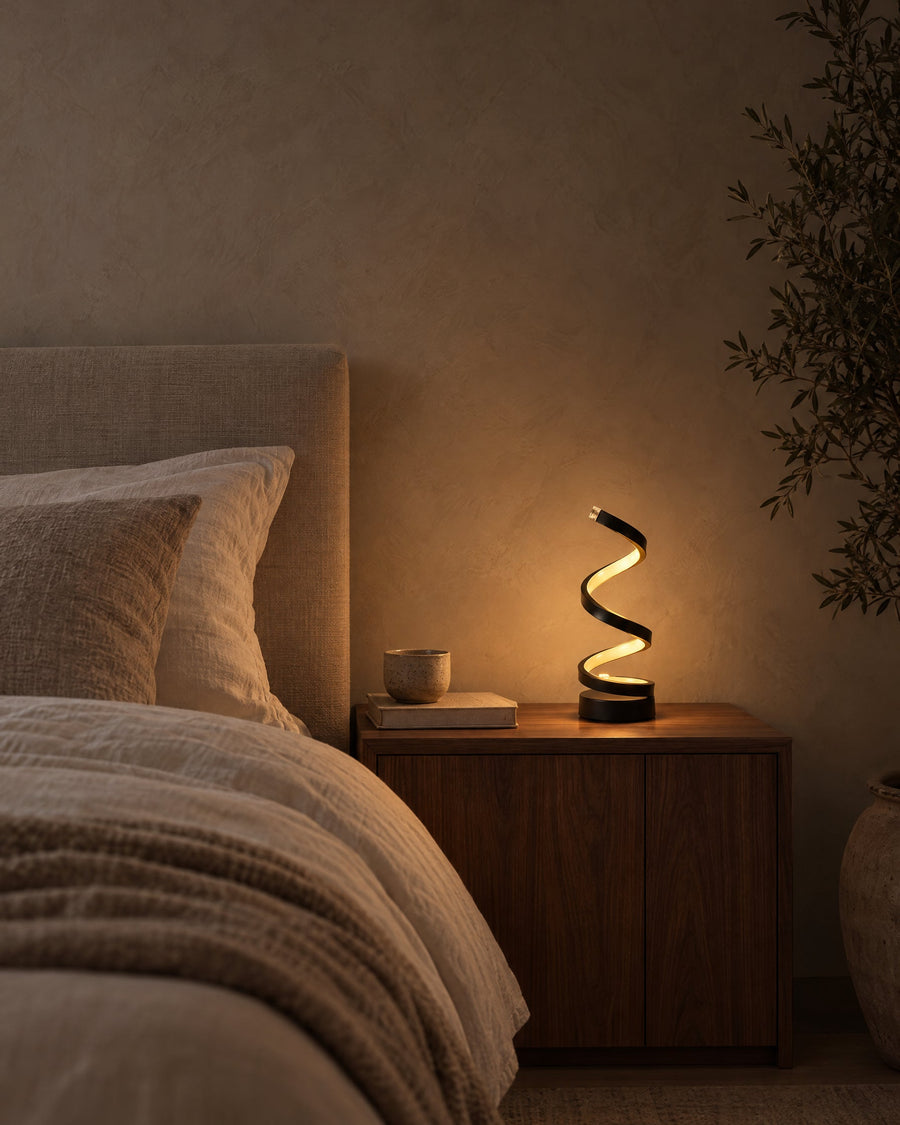 Spira table lamp as a night light on a bedside table