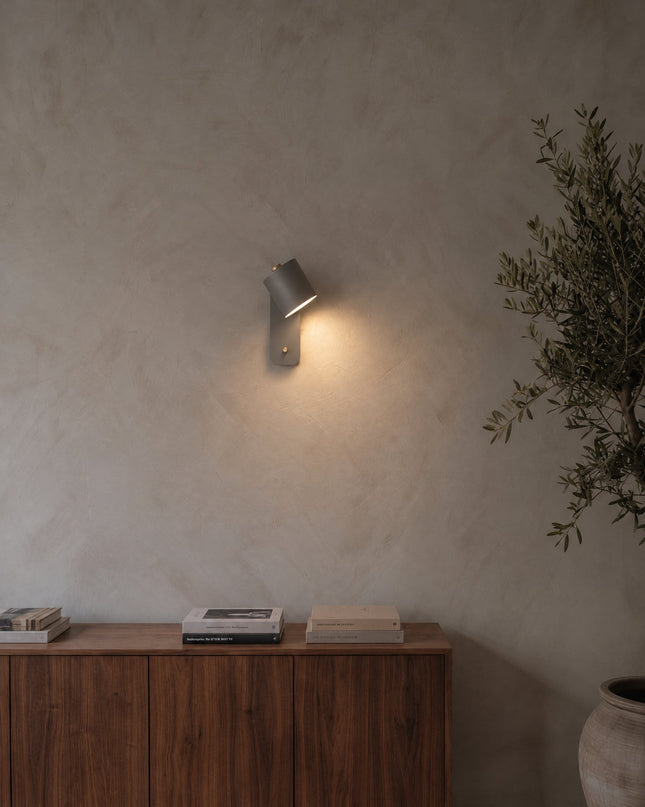 Treviso wall light in grey on a lime plaster wall