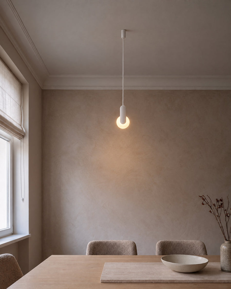 Nantes ceiling lamp with white ring above a dining table