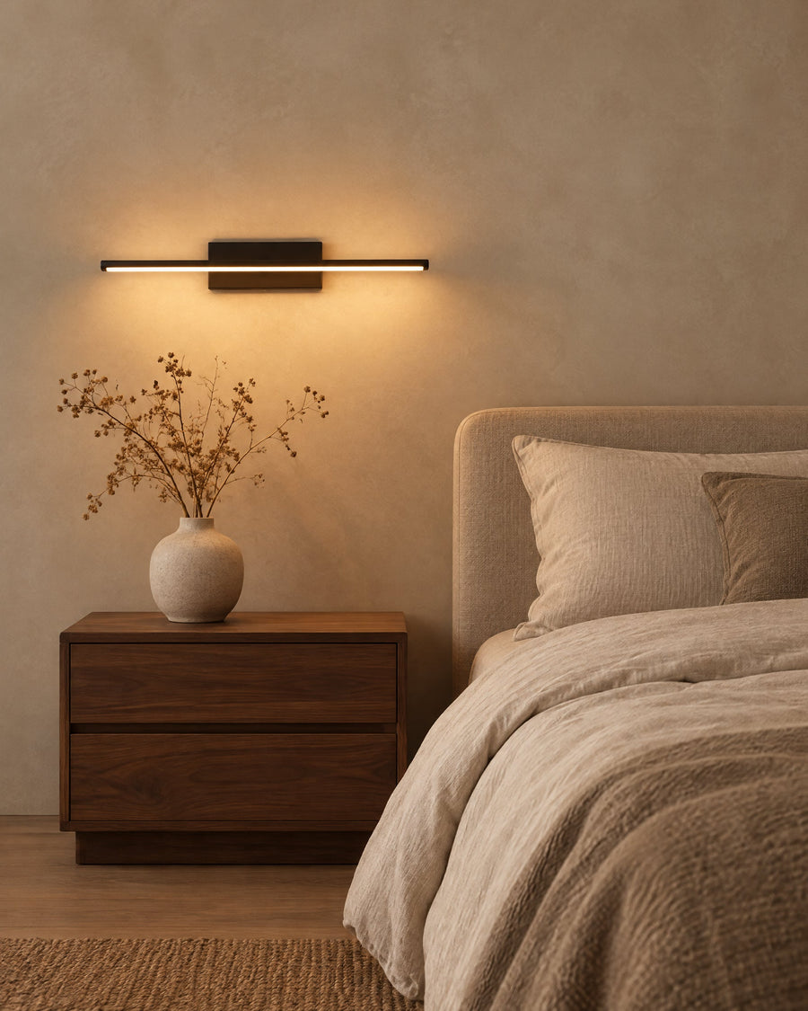 Rome wall light in a bedroom next to the bed