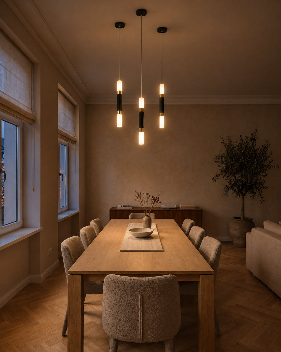 Three Rennes LED pendant lights above an oak dining table