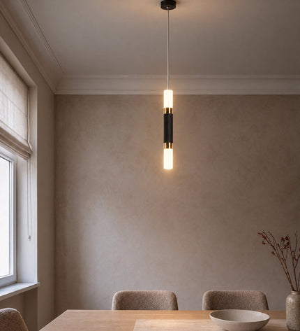 Rennes LED lamp in black with gold rings above a dining table