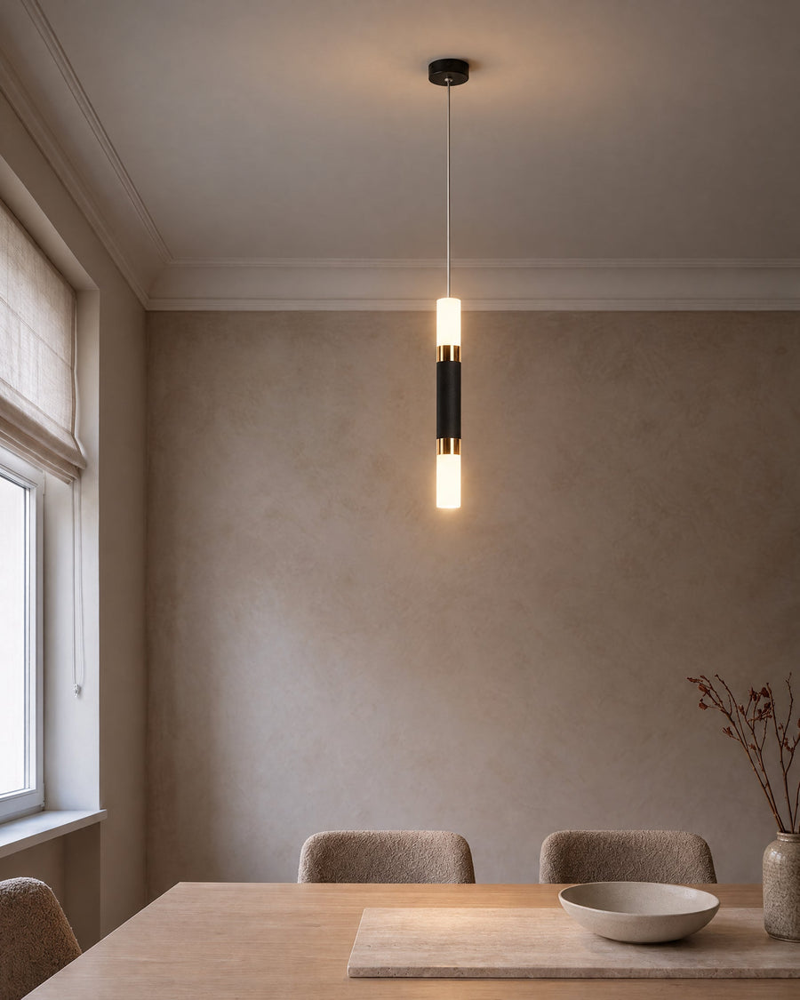 Rennes LED lamp in black with gold rings above a dining table