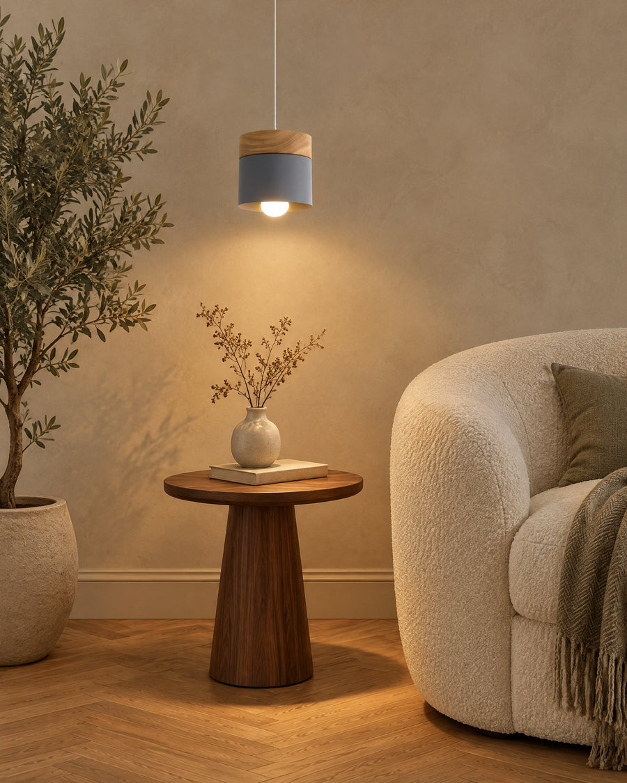 Montpellier pendant light in a living room next to a bouclé armchair