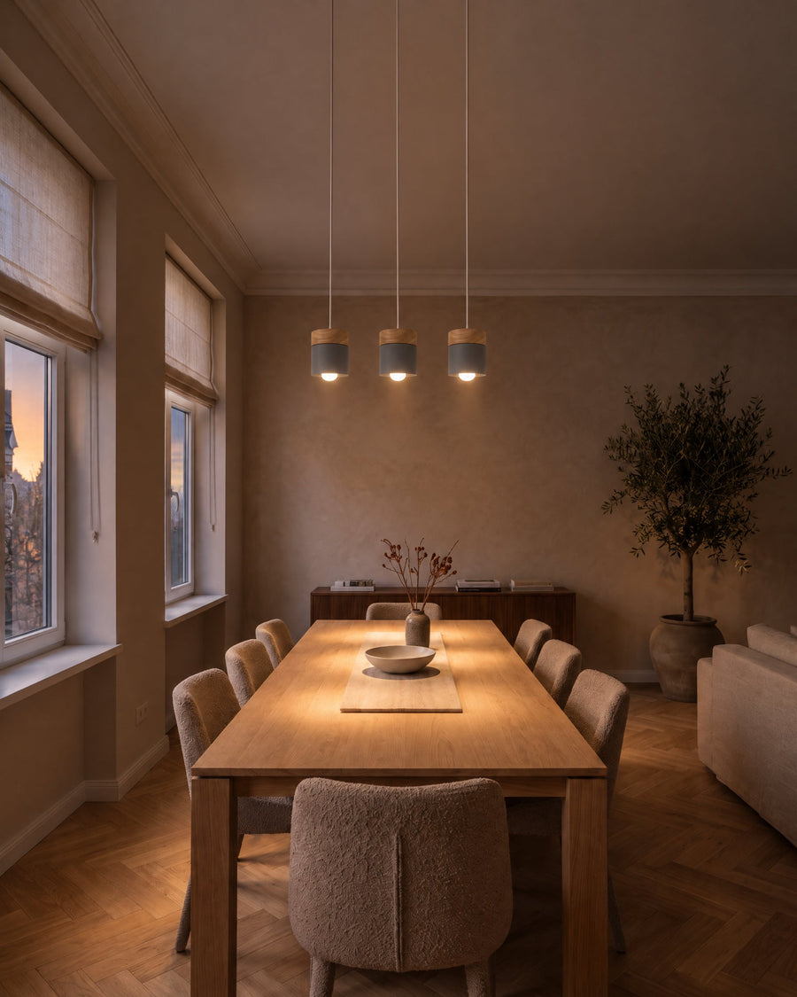 Three Montpellier pendant lights in a row in a dining room
