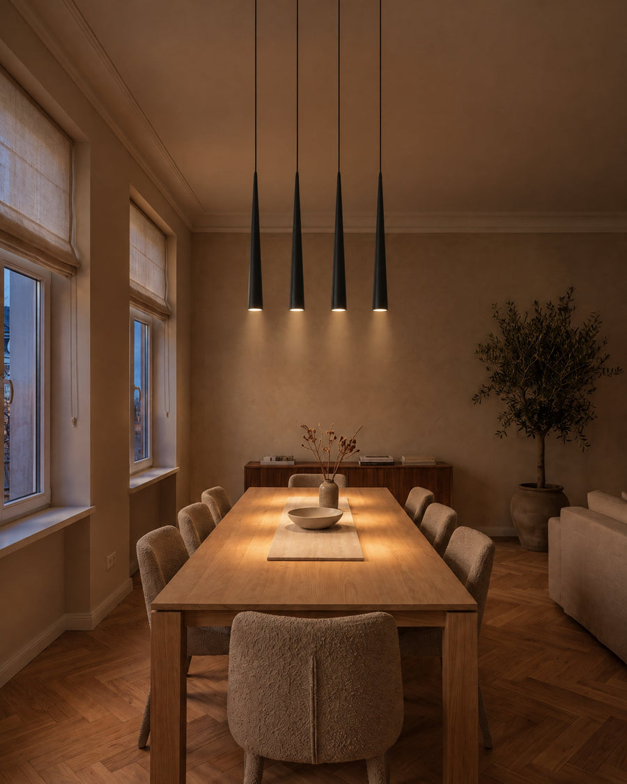 A row of Lille pendant lights above the dining table in the dining room