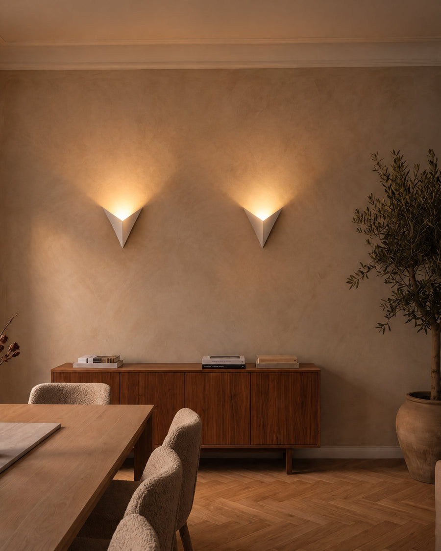 Two Aurelia wall lights above a sideboard in the dining room
