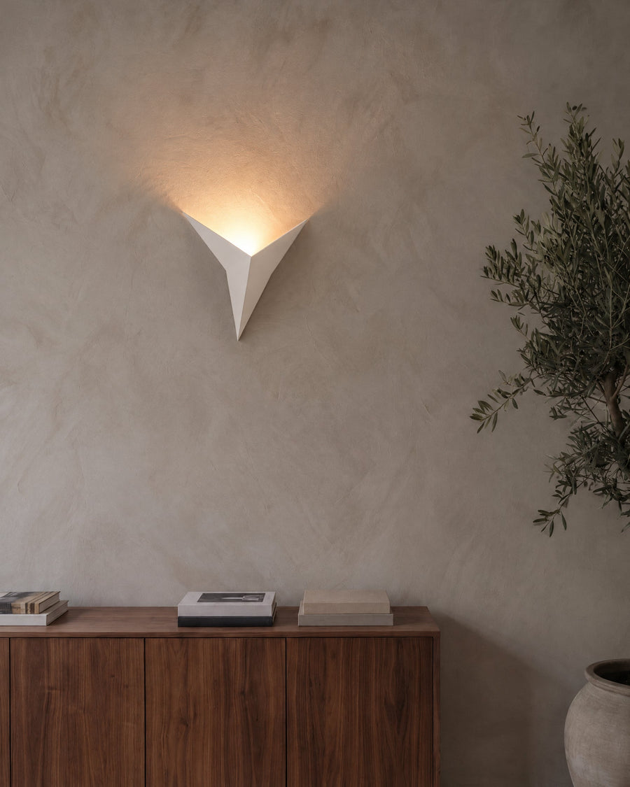 Aurelia wall light casting a fan of light on the wall