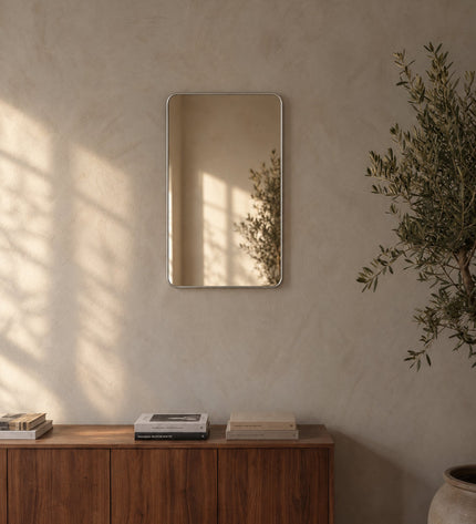 Avela wall mirror on a lime plaster wall