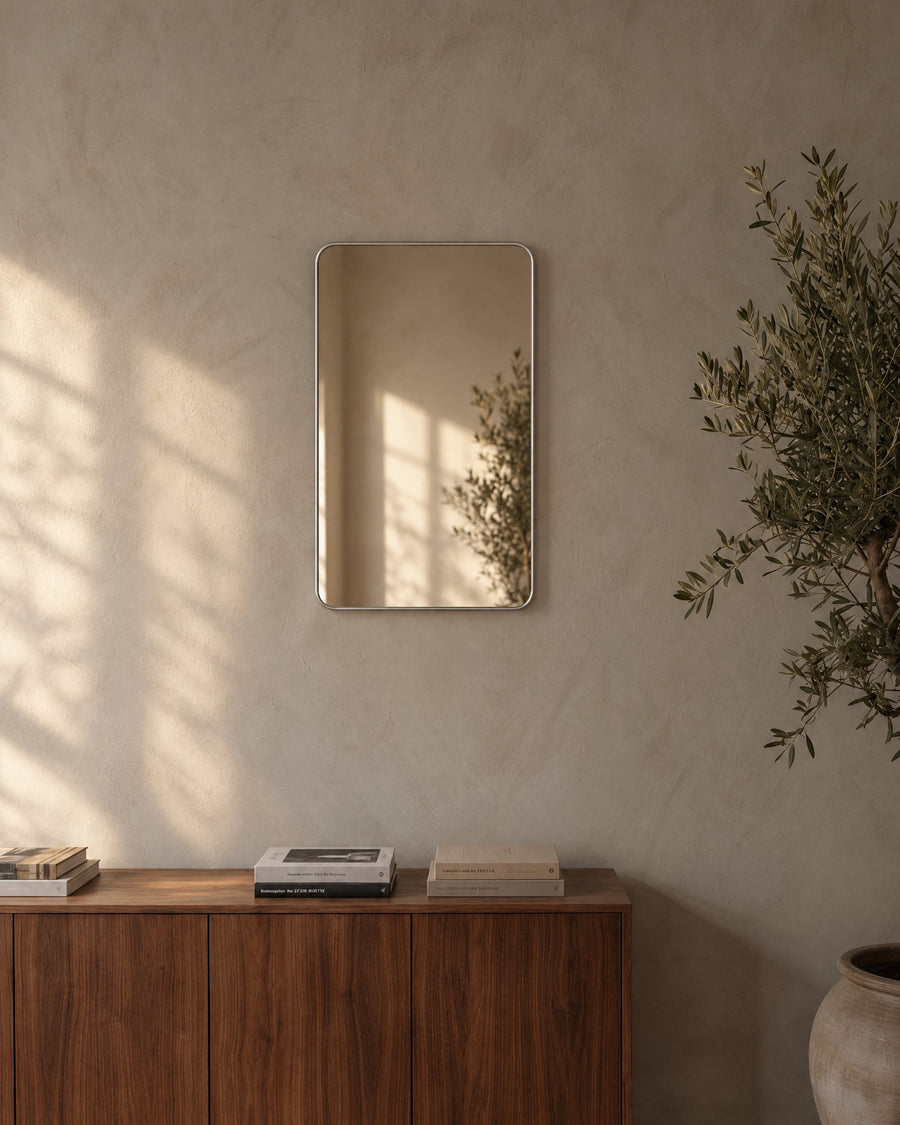 Avela wall mirror on a lime plaster wall