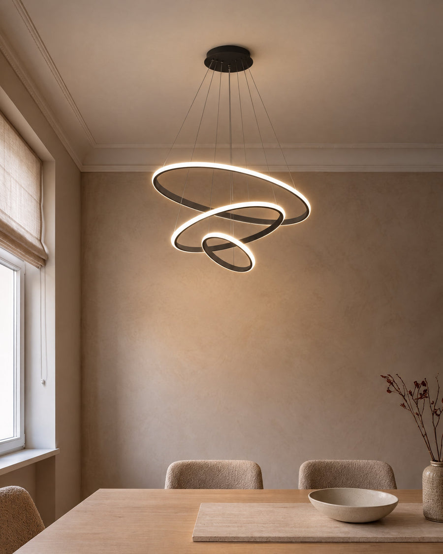 Arion pendant light in black with three LED rings above the dining table