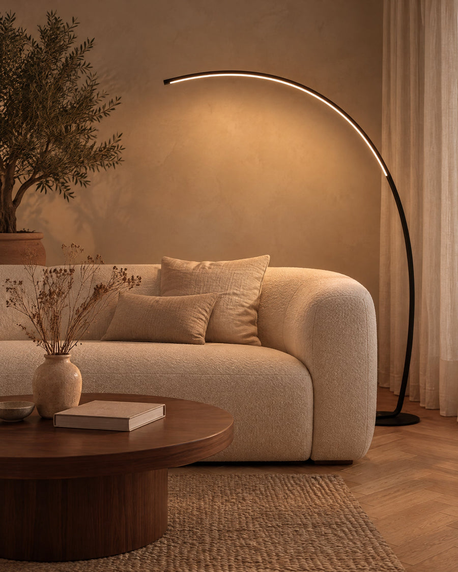 Arco floor lamp behind the sofa in a living room