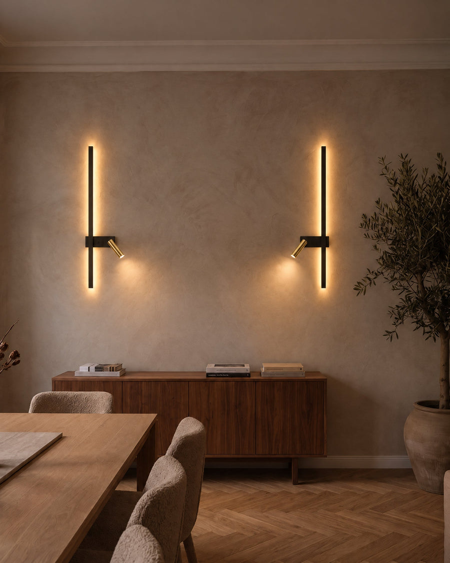 A pair of Norda wall lights above a sideboard in a dining room