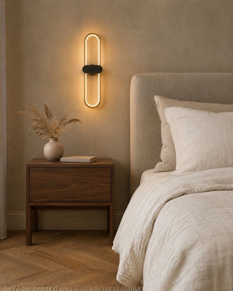 Lunaris wall light next to the bed in a bedroom