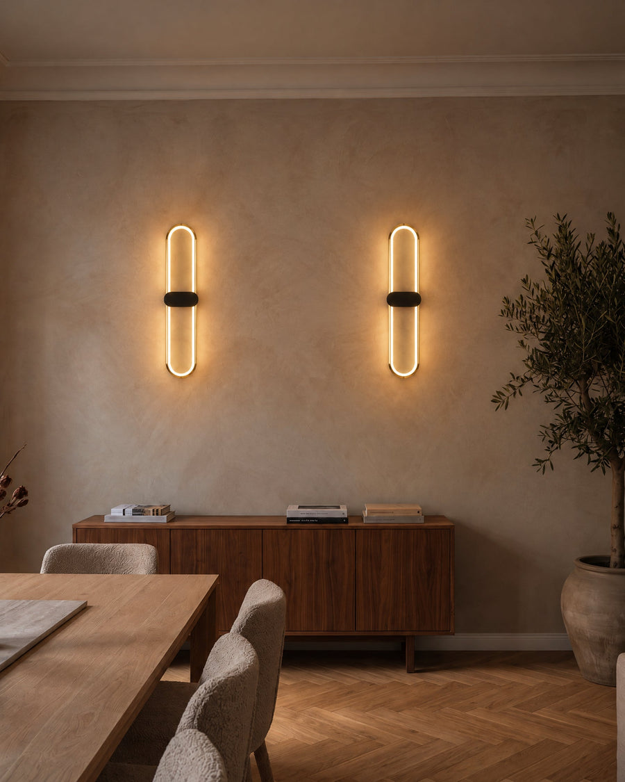 Two Lunaris wall lights above a sideboard in a dining room
