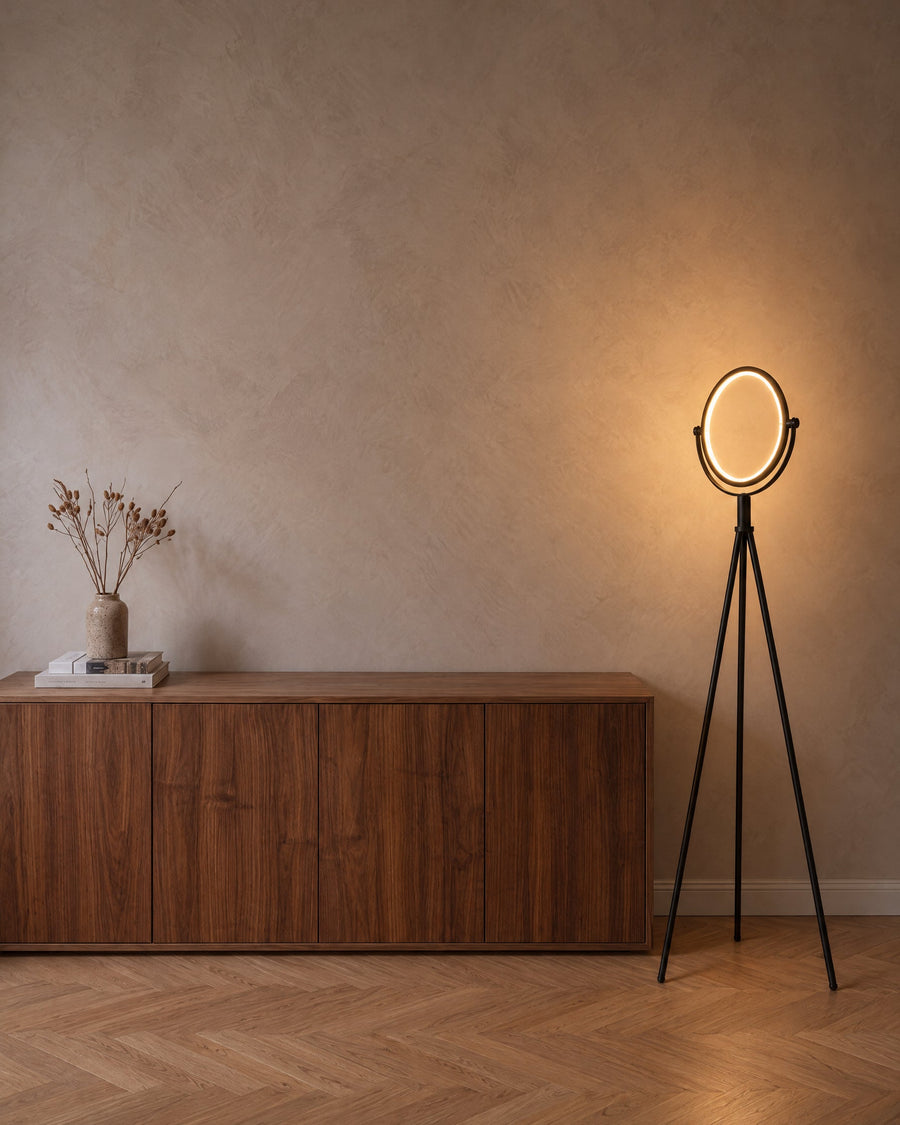 Treo floor lamp with LED ring next to a walnut sideboard