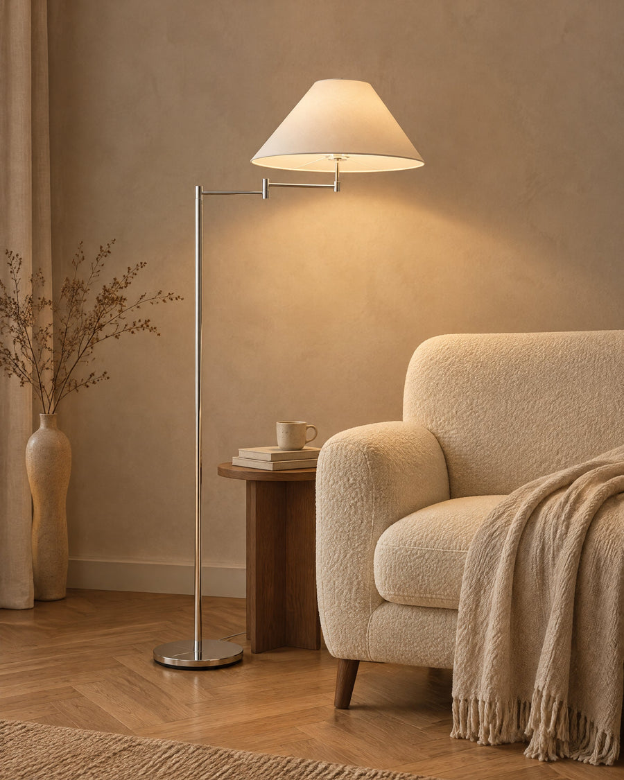 Cromo floor lamp as a reading light next to an armchair