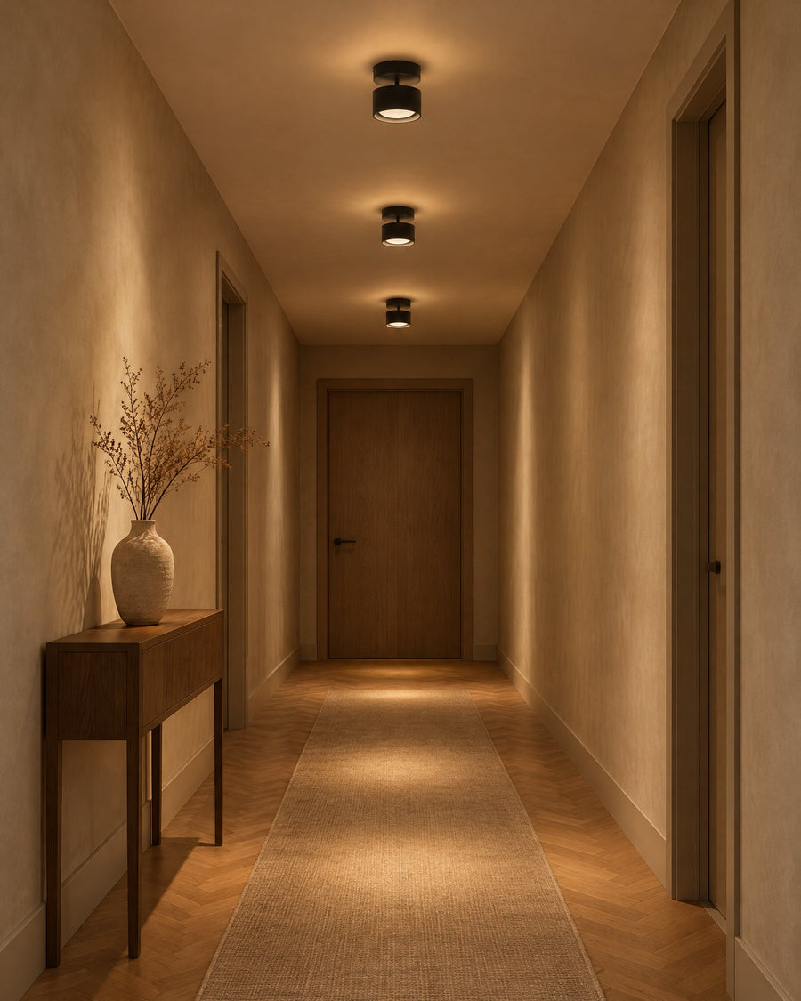 Three Nodo ceiling lights in a row in a hallway