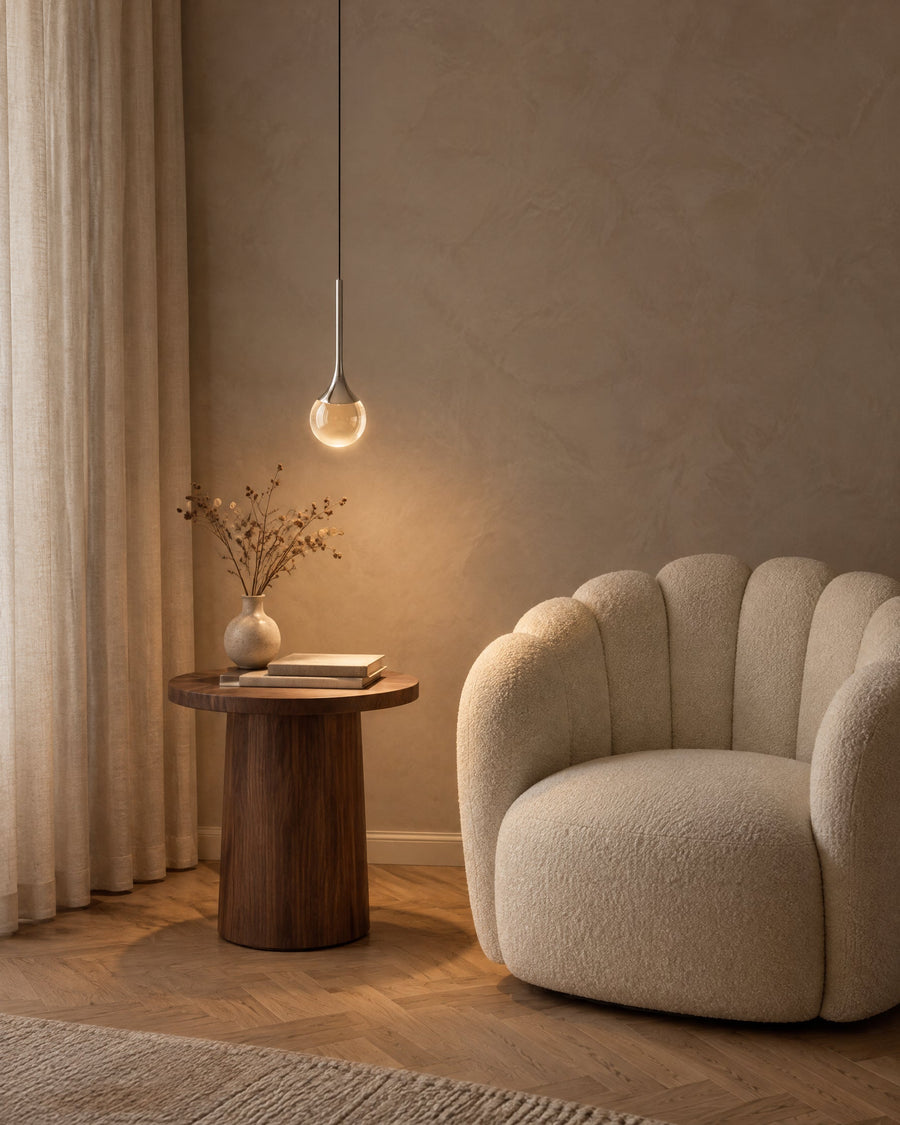 Gota pendant light above a reading corner in a living room