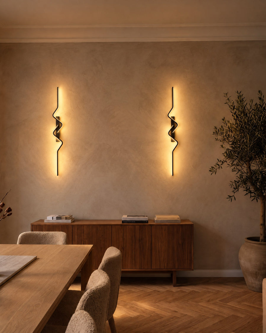 Two Strea wall lights above a sideboard in a dining room