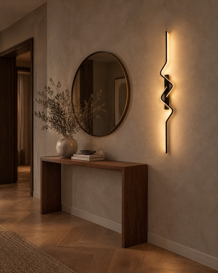 Strea wall light in a hallway next to a console table