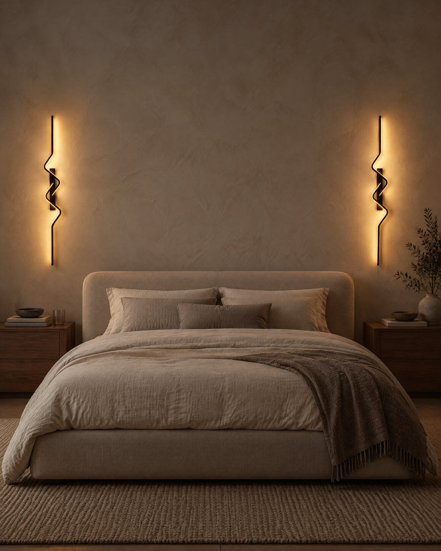 Strea wall lights on either side of the bed in a bedroom