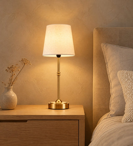 Sera cordless table lamp with fabric shade on an oak bedside table in the bedroom