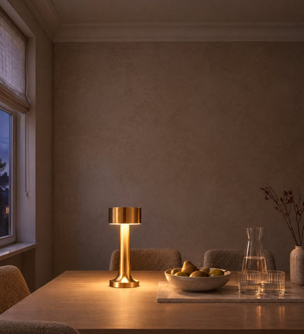 Tondo cordless table lamp in gold on a dining table, no cable