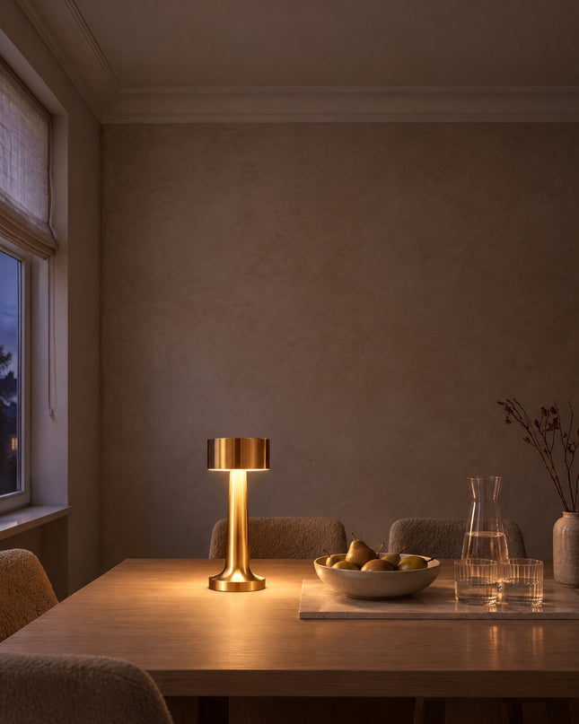 Tondo cordless table lamp in gold on a dining table, no cable
