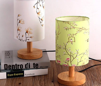 Kezaro Acerra Lamp with modern design and sleek finish, featuring a cylindrical shape and warm light output.