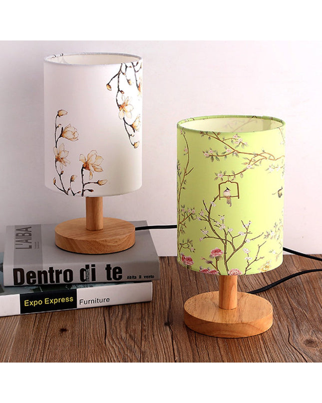 Kezaro Acerra Lamp with modern design and sleek finish, featuring a cylindrical shape and warm light output.