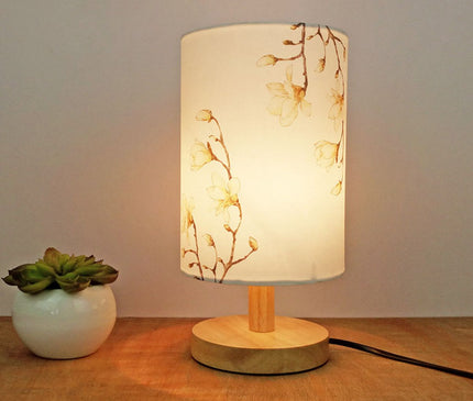 Kezaro Acerra lamp with a sleek modern design, featuring a cylindrical shape and a soft glowing light for stylish home lighting.