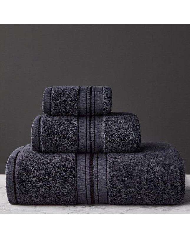 Beige cotton towel set by Kezaro, three soft, plush bath towels with elegant woven texture.