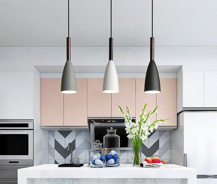 Black Monaco pendant light by Kezaro with a sleek, modern design, hanging from a ceiling fixture.