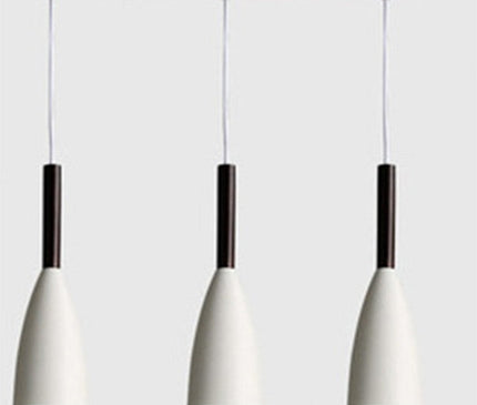 Black Monaco pendant light by Kezaro with a sleek, modern design hanging from a ceiling fixture.