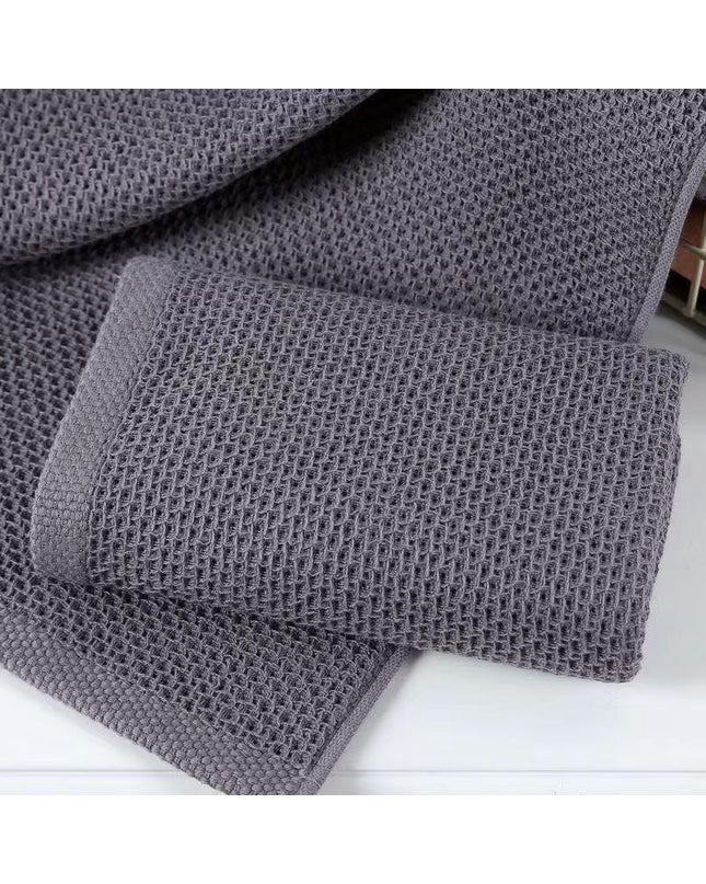 Set of four Kezaro Lamola hand towels in gray, 35x35cm, soft cotton fabric, perfect for bathroom or kitchen use.