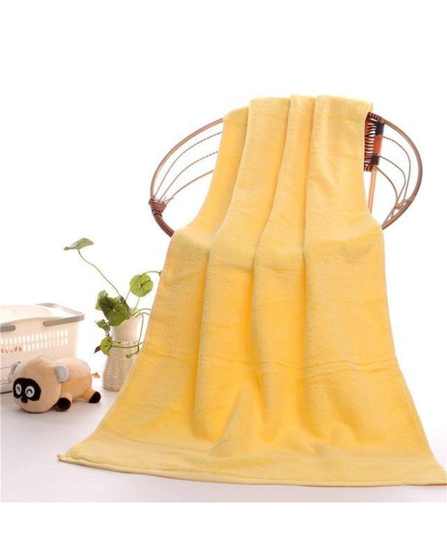 Kezaro Sonnel cotton towel with green and white striped pattern, soft and absorbent for bathroom use.