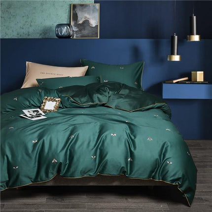 Kezaro Trieste bed linen set with a fitted sheet, duvet cover, and pillowcases in a 4-piece design, featuring elegant patterns.