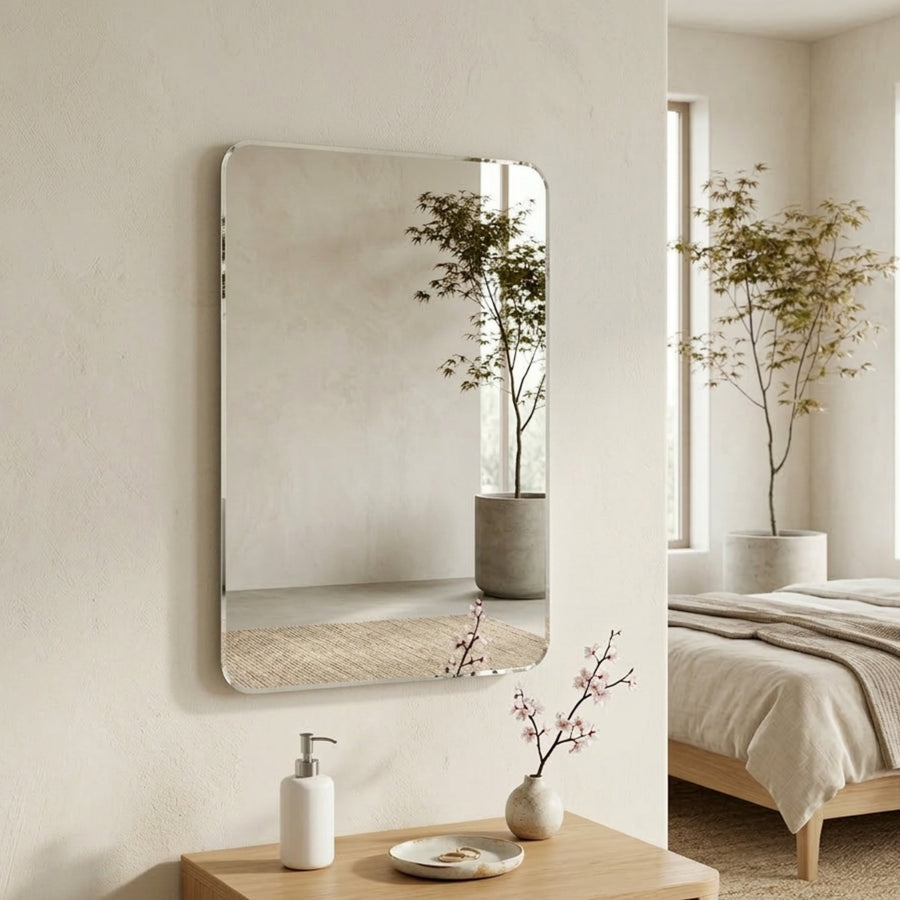 Alera wall mirror above a console table in a bedroom