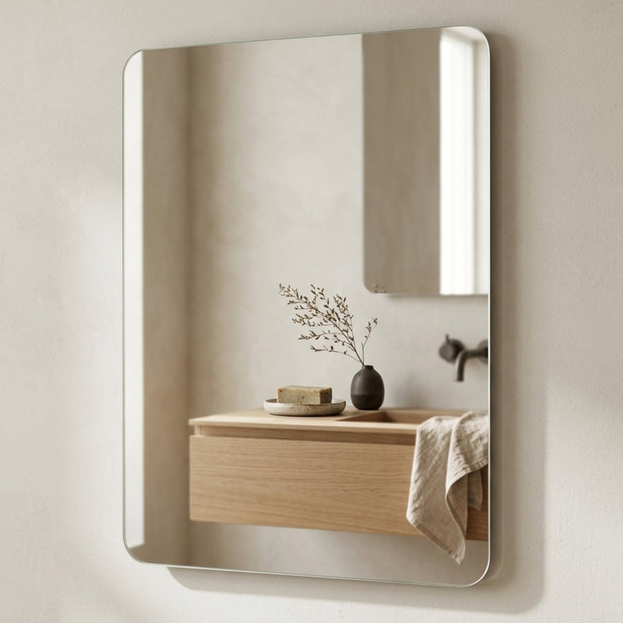 Avela wall mirror above the washbasin in a bathroom