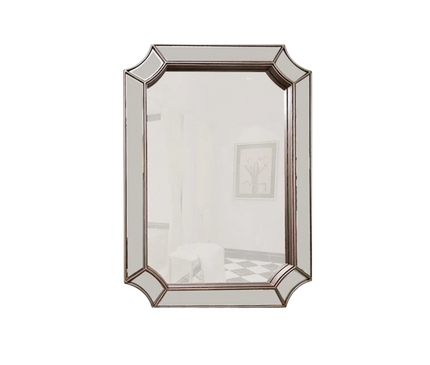 Kezaro Mira wall mirror with faceted frame, modern rectangular design, reflecting natural light and stylish decor.