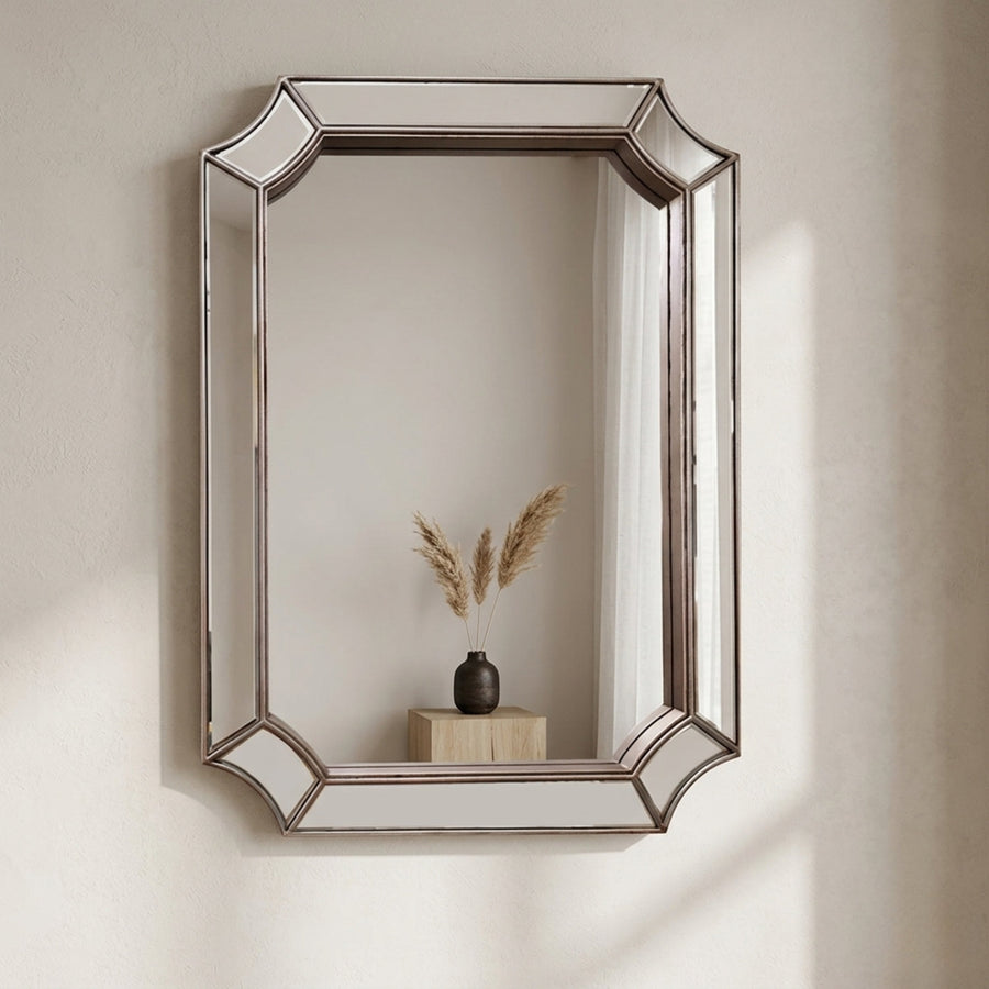 Mira wall mirror in silver on a pale wall