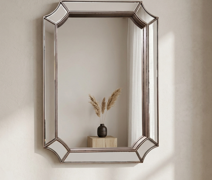 Kezaro Mira wall mirror with faceted frame, round shape, modern design, and reflective glass surface for stylish home decor.