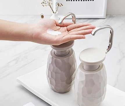 Kezaro warm gray one-handle liquid soap dispenser with sleek design and easy pump mechanism.