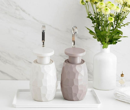 Kezaro warm gray one-hand soap dispenser with sleek design, perfect for modern bathrooms or kitchens.
