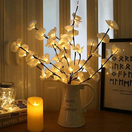 Kezaro white orchid branch with soft LED lights, realistic floral detail, perfect for elegant home decor or floral arrangements.